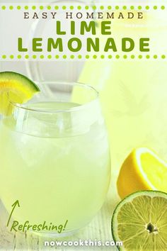 a lemonade drink in a glass with limes around it and the words easy homemade lime lemonade