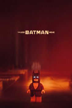 the lego batman movie poster is displayed in front of a dark background with red lights