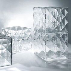 three clear cubes sitting next to each other