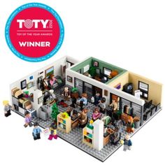 a lego house with people standing around it and the words toy of the year winner