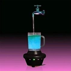 a blender filled with blue liquid on top of a table