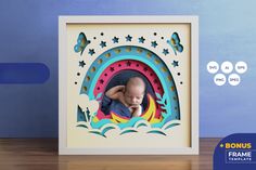 a photo frame with an image of a baby in the center and stars around it