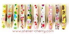 several different colored pencils lined up in a row with hello kitty designs on them