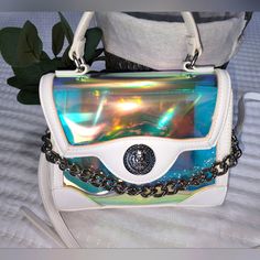 This Bag Is So Cute! Perfect For Concerts, Ball Games, Anything Really. It's A Clear Holographic Bag With A Chunky Silver Chain. Pictures Don't Do This Bag Justice! Carry As Top Handle Or Crossbody. Nwt White Bags With Removable Pouch As Fashion Accessory, Trendy White Satchel, White Bag With Adjustable Strap For Fashion, Trendy White Shoulder Bag, White Bag With Adjustable Strap, Trendy White Bag With Chain Strap, White Top Handle Satchel With Mobile Phone Bag, Trendy White Crossbody Bag, Trendy Top Handle Shoulder Bag With Clear Strap