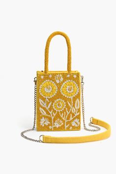 And it was all Yellow! A truly bright and beautiful mini tote with a special rectangular box shape, our Lemon Blossom beaded mini tote is the epitome of a Spring Summer delight. With gorgeous beaded top handles, fully hand beaded in floral garden embroidery this bag exudes summer vibes. Its fully lined interiors and De