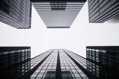 looking up at skyscrapers from the ground