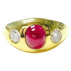 Oval Cabochon Ruby And Diamond Ring, Oval Cabochon Ruby Ring With Diamonds, Oval Ruby Ring With Vvs Clarity Diamond, Luxury Oval Three-stone Ruby Ring, Red Diamond Oval Cabochon Ring, Classic Three Stone Ruby Ring In Yellow Gold, Classic Three Stone Yellow Gold Ruby Ring, Classic Yellow Gold Three Stone Ruby Ring, Oval Ruby Ring With Three Diamonds