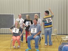 a group of people standing and sitting around each other