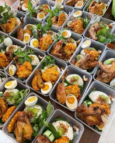 several trays filled with different types of food