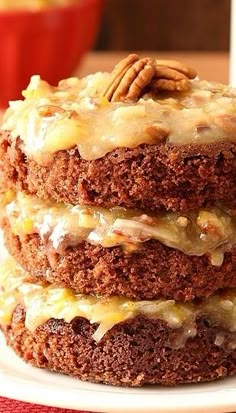 a stack of cake sitting on top of a white plate