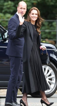 the duke and princess of cambridge wave to their fans as they arrive for an official event