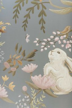 a rabbit sitting on top of a flower filled wallpaper covered in leaves and flowers