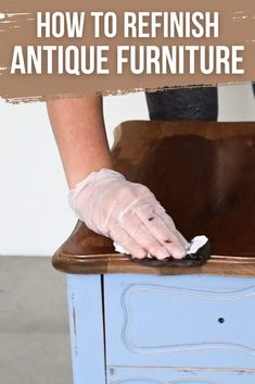 a person with white gloves on top of a blue cabinet and the words how to refinish antique furniture