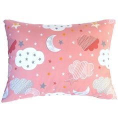 a pink pillow with stars and clouds on it