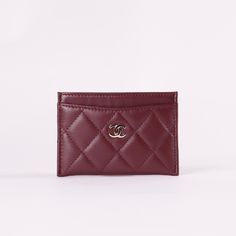 * Burgundy Quilted Lambskin Leather* Silver-Tone Hardware * Interlocking CC Accent at Front Face* Four Card Slots* Tonal Stitching * Dimensions: L 4.3" x H 3" Ysl Card Holder Hearts, Luxury Classic Red Card Holder, Burgundy Car, Chanel Card Holder, Dream Wishlist, Red Chanel, Classic Card, Front Face, Car Holder