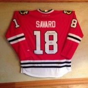 a hockey jersey hanging on the wall