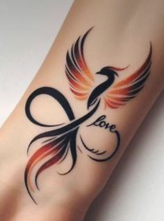 a tattoo on the foot of a person with an orange and black bird design on it