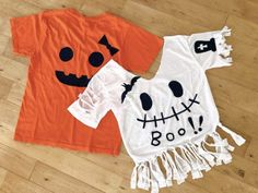 two t - shirts that have been made to look like pumpkins and ghost faces