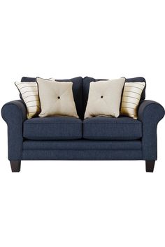 a blue couch with two pillows on it's back and one pillow in the middle