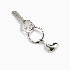 a metal keychain with a letter on the front and bottom part of it