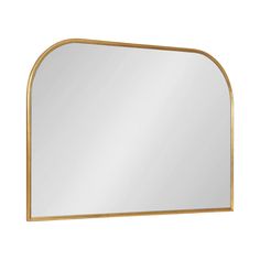 a large gold framed mirror on a white wall with an arched design in the middle