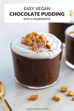 chocolate pudding with whipped cream and walnuts on top in small glass bowls next to gold spoon