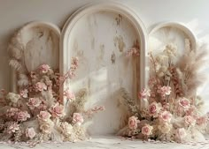 an old wall with flowers and feathers on it in front of three arched windows that have been painted white