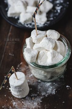 small marshmallows in a glass bowl with toothpicks