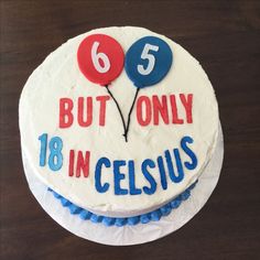 a white cake with blue and red icing that says 65 but only 10 in celsius