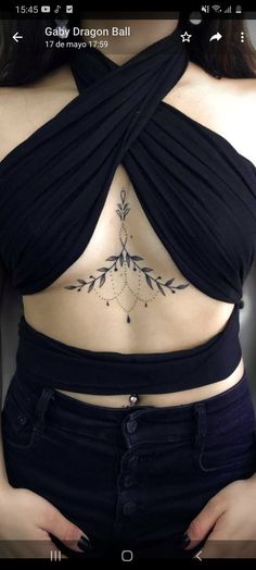 an image of a woman with tattoos on her stomach