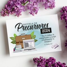 purple flowers surrounding a white card with the words precurvores on it