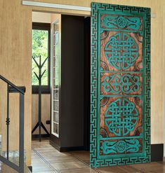 an intricately designed wooden door in the entry way