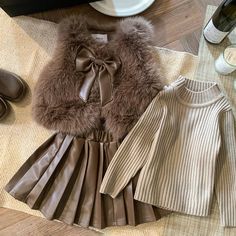 Elegant Girls' Fall 3-Piece Set includes a 100% knit cotton sweater, leather skirt, faux fur vest. Beret not Included. Care instructions: Hand wash only. Dry gently or on a low setting. Ideal as a gift for birthdays, holidays, or to make any day extra special for the young girl in your life. Available in two colors: Beige and Brown. Sweater Leather Skirt, Brown Skirt Outfit, Elegant Girls, Leather Skirt Outfit, French Beret, Kids Frocks Design, Girls Fall, Baby Clothes Patterns, Elegant Girl