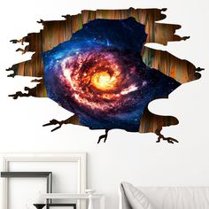 a wall sticker with an image of a spiral galaxy in the center and stars on it