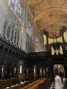 the interior of a cathedral with stained glass windows