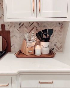 the kitchen counter is clean and ready to be used as a utensil holder