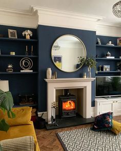 a living room filled with furniture and a fire place