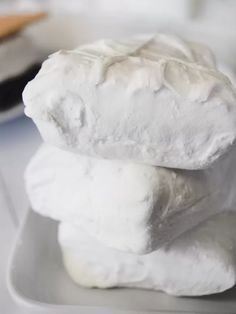 three white marshmallows stacked on top of each other