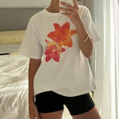 Tropical Graphic Printed Orange and Pink Flower on a white basic t-shirt. Perfect casual graphic T for summer.  Made from Cotton Polyester Blend.  Size Guide in cm:  S Length: 56Bust: 94 Sleeve: 20Shoulder: 38 M Length: 57Bust: 98 Sleeve: 21Shoulder: 39 L Length: 58Bust: 104Sleeve: 22Shoulder: 40.5 XLLength: 59Bust: 110Sleeve: 23Shoulder: 42 Size Guide in inches:  S Length: 22.05Bust: 37.01Sleeve: 7.87Shoulder: 14.96 M Length: 22.44Bust: 38.58Sleeve: 8.27Shoulder: 15.35 L Length: 22.83Bust: 40.9 Aesthetic Star, Baby Tee Shirts, Yoga Dress, T Shirt Aesthetic, Lace Trim Shorts, Long Knitted Dress, Shirt Aesthetic, Top Streetwear, Floral Outfit