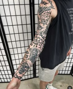 a man with a tattoo on his arm