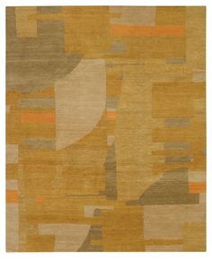 an area rug with various colors and shapes on the ground, including oranges, browns, yellows, grays