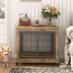 a dog is standing in front of a wooden table with a birdcage on it