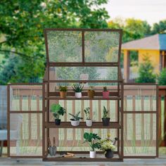 the houseplants are arranged on top of each other in front of a fence