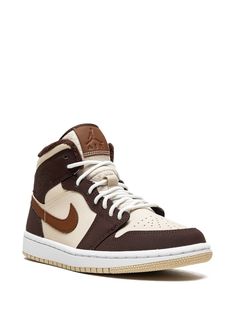 The Jordan Air 1 Mid SE sneakers feature a paneled design, ankle length, branded insole, flat rubber sole, and front lace-up fastening. These sneakers are supplied by a premium sneaker marketplace that sources sought-after footwear. Brown Jordan 1, Jordan Air 1, Jordan Mid, Custom Painted Shoes, Sneakers Brown, Air Jordan 1 Mid Se, Shoe Wishlist, Jordan 1s, Jordan Air