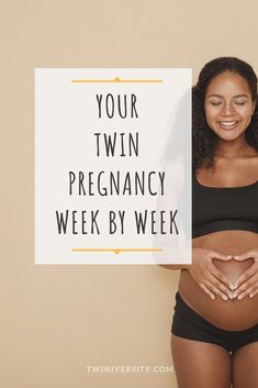 a pregnant woman holding a sign that says your twin pregancy week by week