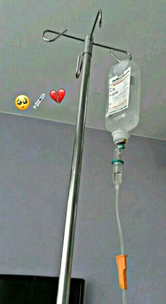 a medical device attached to the ceiling with emotication stickers on it's side