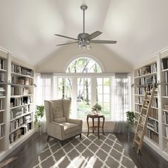 a living room filled with furniture and a ceiling fan