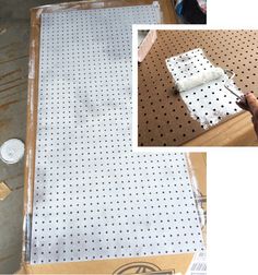 there is a piece of paper that has been placed on the pegboard with holes in it