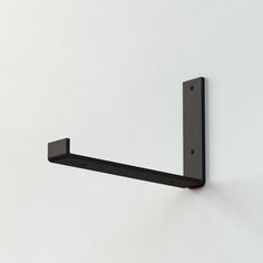 Single metal shelf bracket for secure and modern wall shelving, ideal for home organization. Floating Shelves Black Brackets, L Brackets For Shelves, Black Metal Shelf Brackets, L Bracket Shelves, Wood Shelf Black Brackets, Brackets For Shelves, Long Shelves, Heavy Duty Black Shelf Brackets, Wall Shelf Display