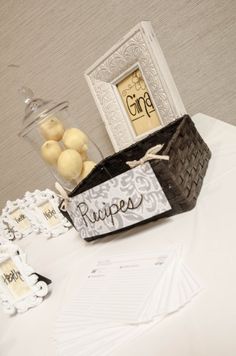 a table topped with a basket filled with apples